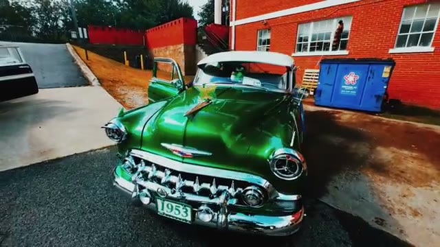Green 1953 Chevrolet front end with chrome grille